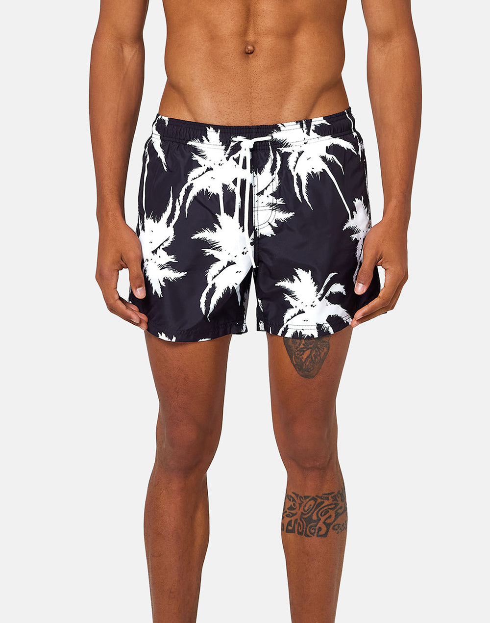 SHORT SWIM SHORTS WITH AN ELASTICATED WAISTBAND MULTIPALM PRINT